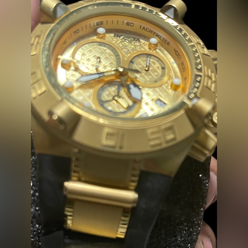 Invicta— Gold bezel/black silicone band